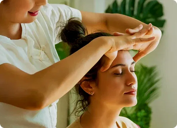 a woman getting a head massage