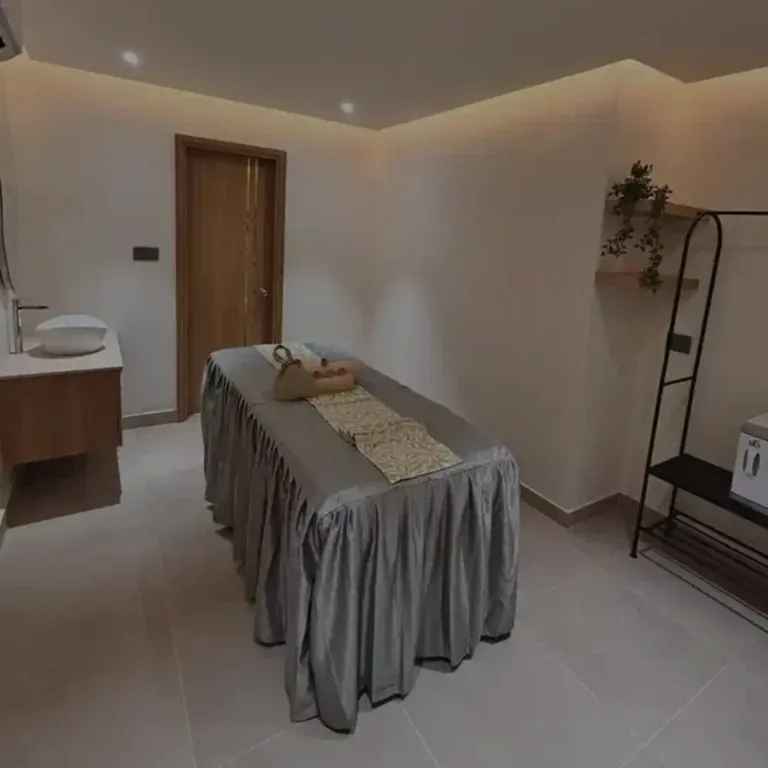 Single treatment room at Tattva Wellness Spa, Trunk & Trolley Hyderabad, featuring a neatly arranged massage bed, soft lighting, and soothing modern interiors for a peaceful wellness experience.